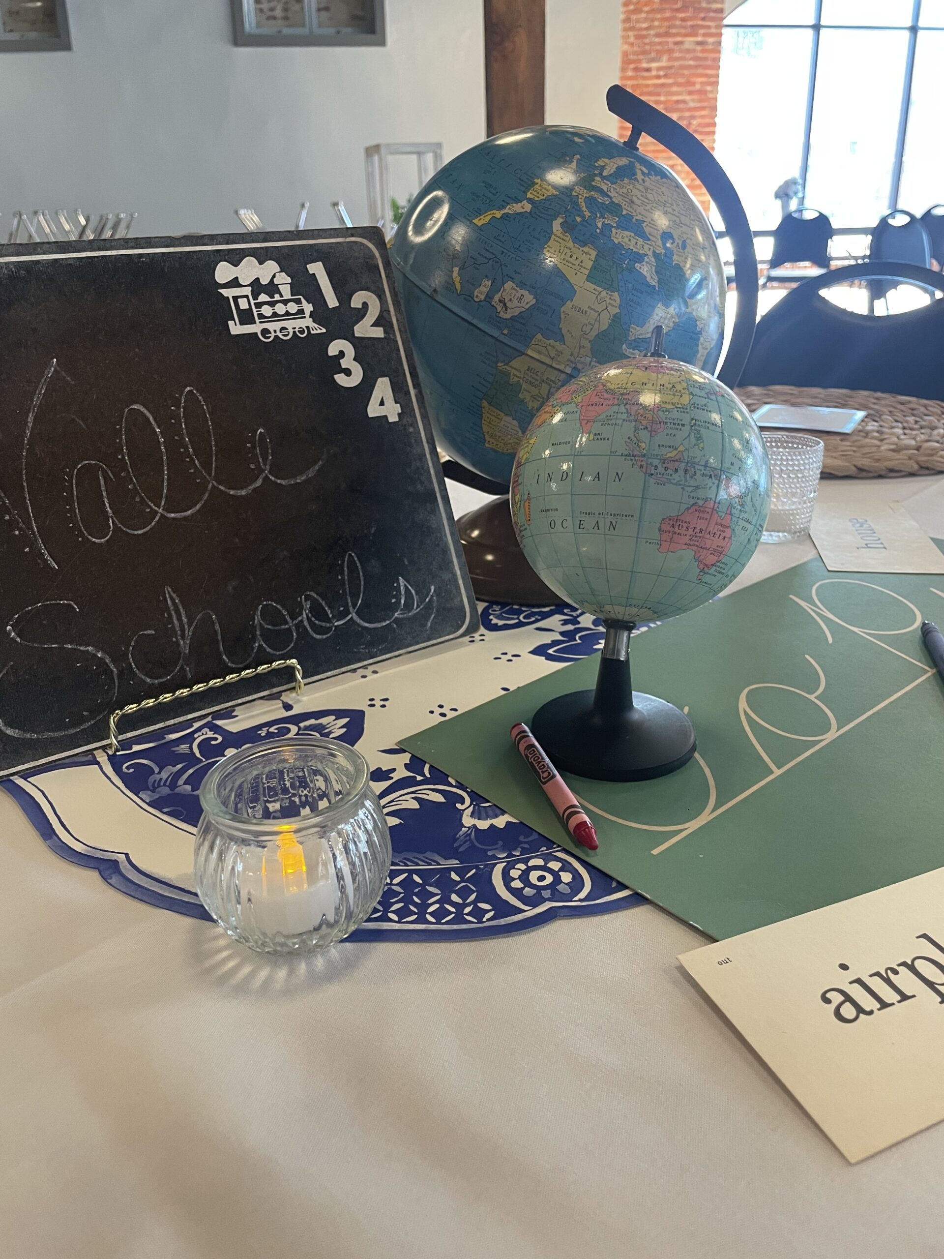 image of globes, chalkboard, and decor on a table